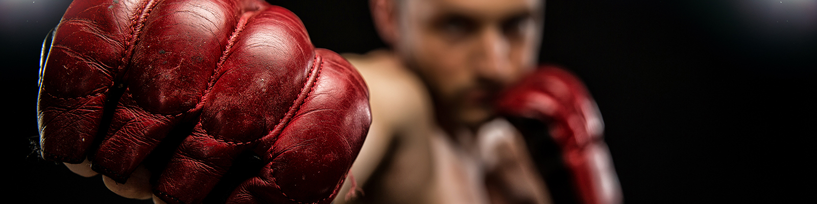 MMA fighter with red gloves on